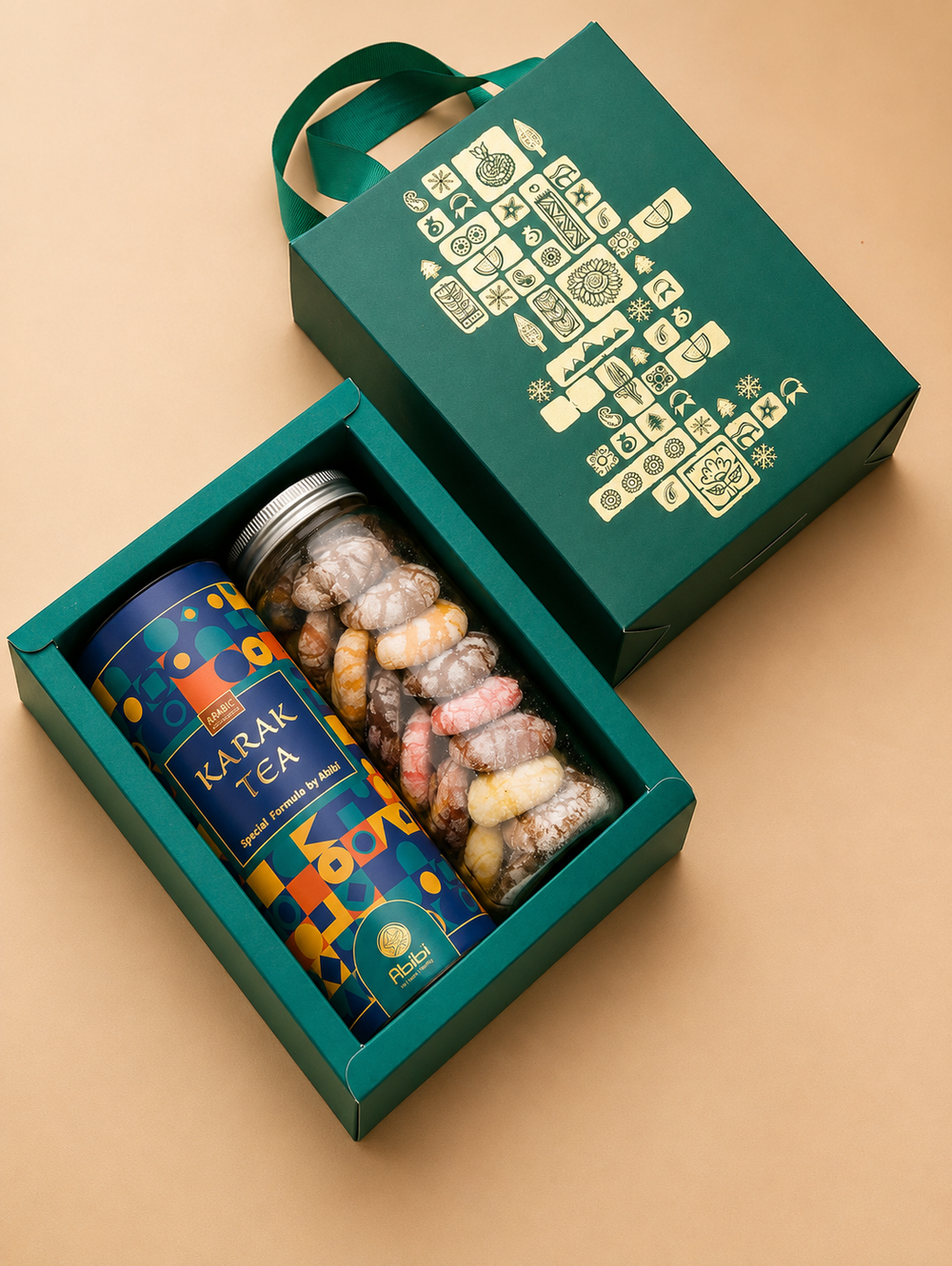Tea canister and decorative jars in a green box on a beige background