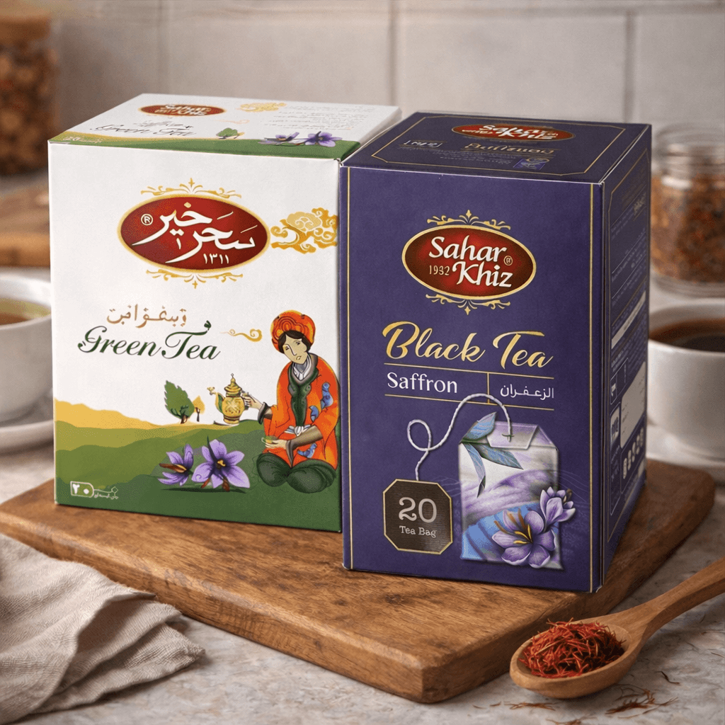 Saharkhiz saffron tea collection featuring green tea and black tea boxes, each containing 20 tea bags, displayed on a wooden board.